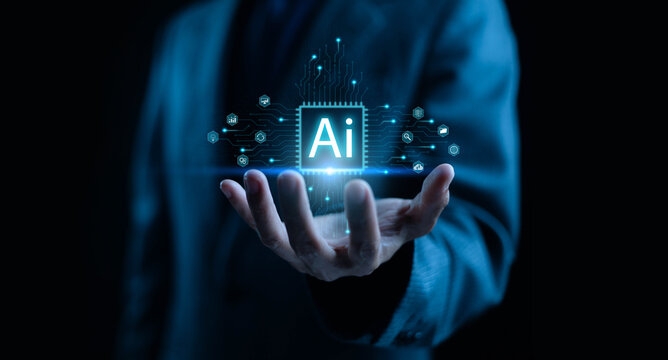 A futuristic business concept showing artificial intelligence technology glowing above a businessman’s hand, symbolizing innovation, digital transformation, data analysis, and advanced AI solutions.