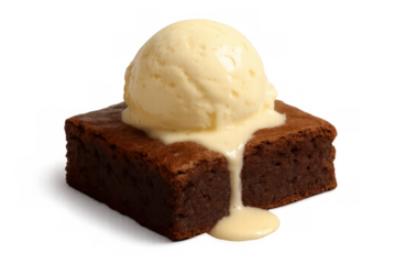 Brownie a la mode with melting vanilla ice cream topping a chocolate dessert on transparent background