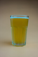 Full beer in glass with foam, refreshing cold beer