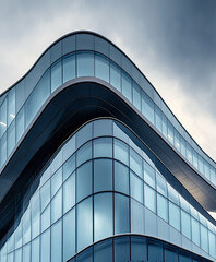 Futuristic office building with sharp curves and glass facade