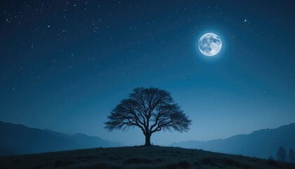 A solitary tree silhouetted against a night sky with a full moon and distant mountain range view