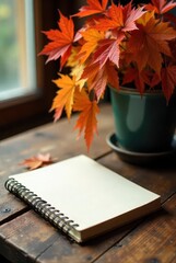 Autumnal Still Life Blank Notebook Beside a Pot of Vibrant Maple Leaves on Rustic Wood