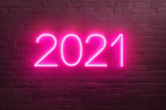 Neon Pink Light 2021 Year Sign on Grunge Wall Background