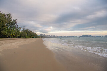 Gorgeous beach lined with palm trees near Sanya.