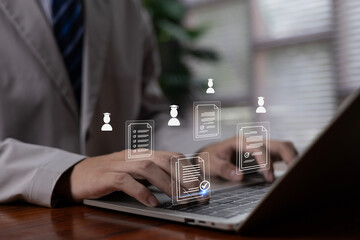 A professional managing digital documents and HR data on a laptop with virtual icons, representing online document processing, recruitment systems, and modern workflow management solutions.