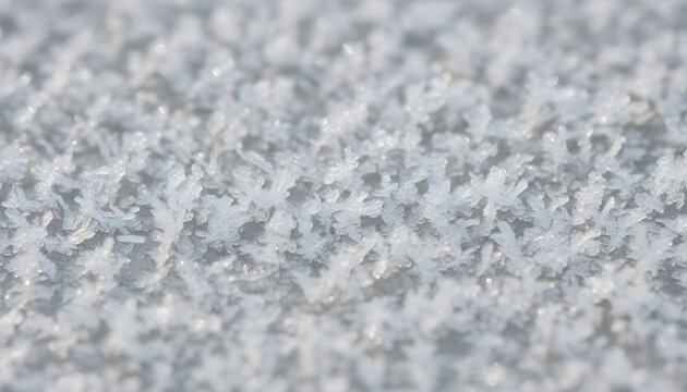 Macro close-up of fresh snow crystals showing intricate winter texture, clean and crisp details ideal for seasonal backgrounds, graphic design and high-resolution stock imagery.