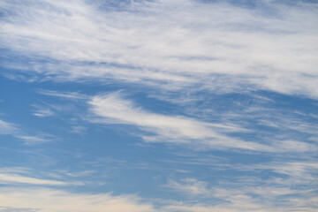 A Serene Sky Displaying Wispy Clouds Floating Gracefully Across the Vast Expanse Above