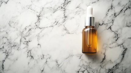 Skincare serum bottle with dropper on a marble surface