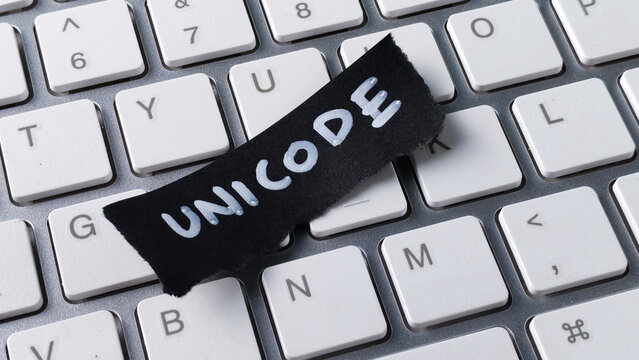 Unicode Encoding Standard Concept with Black Paper Note on Computer Keyboard Keys for Programming and Global Communication