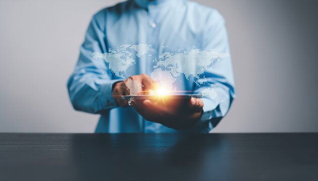 Man interacts with a digital world map on a tablet, showcasing connectivity and technology. - Powered by Adobe