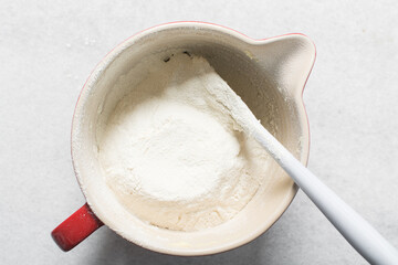 top view of plain vanilla cookie dough being mixed, process of making sugar cookies