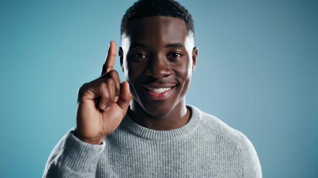 African American Man Raising Index Finger for Attention or Idea