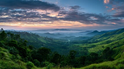 Sunrise Over Lush Green Hills and Valleys with Low Clouds Landscape