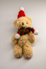 Cute teddy bear wearing santa claus suit to celebrate christmas on white background