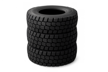 Stacked black rubber truck tires with deep tread pattern, symbolizing heavy-duty automotive industry transport service