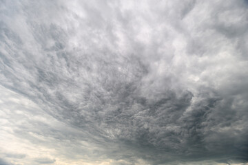 A Dramatic and Overcast Cloudy Sky Filled with Dark Gray Layers and MoodImbuing Elements