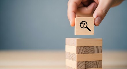 Hand Placing Key Symbol Block on Wooden Tower Business Solution Concept