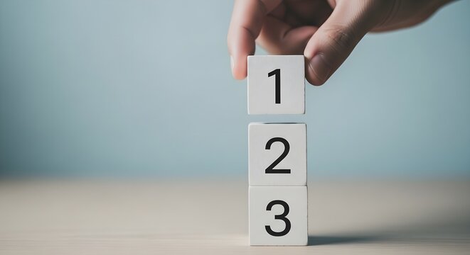Hand Placing Number One Block on Top of Sequential Numbered Cubes Step by Step Process Concept