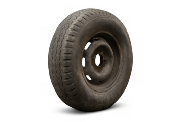 Dirty, weathered automotive wheel with rusted steel rim and worn tire, abandoned scrap symbolizing vehicle breakdown and waste