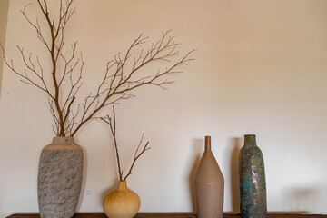 Different ceramic vases on wooden background, The Pottery Gallery.