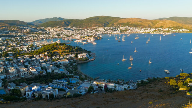 Bodrum, Turkey. Aerial drone panorama of Bodrum featuring Tiger Tower on hill, yachts in marina and bay, Bodrum Castle, beaches and white houses.. Aerial View
