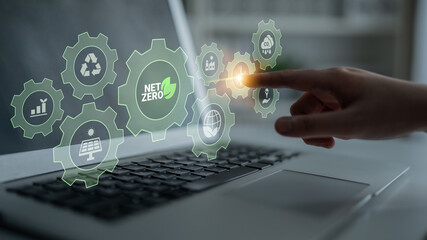 Interconnected green gears with icons representing renewable energy, carbon reduction, recycling, and eco innovation working toward a net zero goal Parse