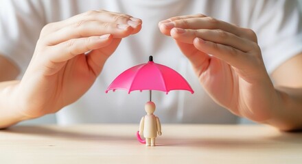 A person hands protecting a small figurine with an umbrella. Concept of insurance or security.