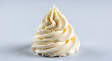 Beautiful swirl of vanilla buttercream frosting elegantly piped for cake decorating and dessert presentation. isolated on white background