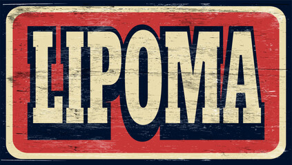 Aged and worn lipoma sign on wood