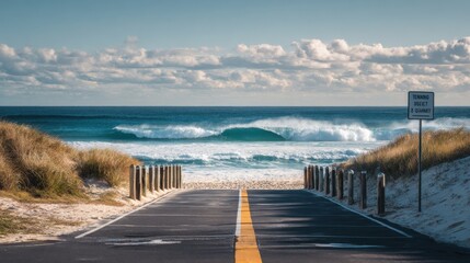 A road with a sign that says Happy Your Day. The road is next to a beach with a large wave crashing in the background