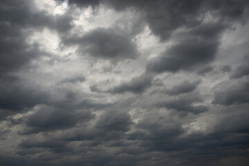 Dramatic sky presents with ominous, heavy dark cloud formation. Gloomy weather creates moody atmosphere, promising rain or powerful storm. This natural view shows impending atmospheric change