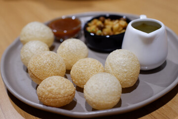 Indian food pani puri, crispy snack and delicious traditional appetizer. Spicy treat delivers joyful culinary delight, flavorful and mouthwatering meal for happy celebration
