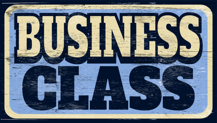 Aged retro business class sign on wood