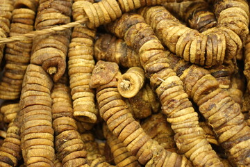 Dried figs texture background showing whole dehydrated anjeer fruit natural brown color closeup
