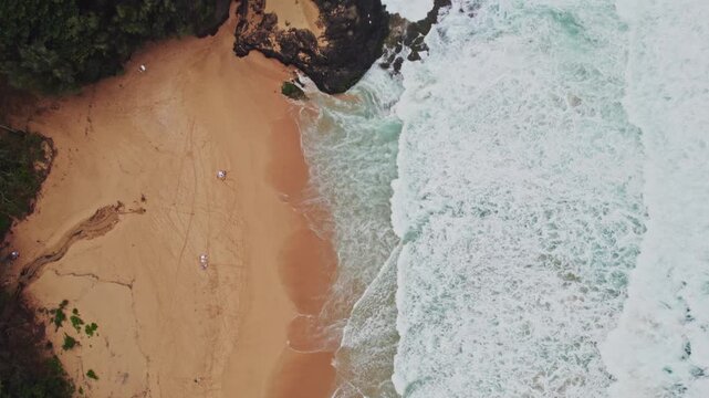 flying over a beach in Kauai