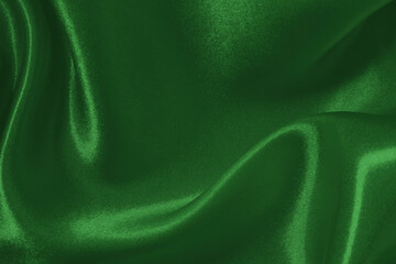 Dark green fabric cloth texture for background and design art work, beautiful crumpled pattern of silk or linen.