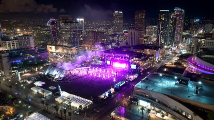 Aerial view of Los Angeles cityscape at night during a music event or festival