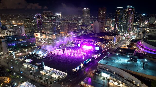 Aerial view of Los Angeles cityscape at night during a music event or festival