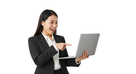 Cheerful Asian businesswoman in a professional suit happily pointing at her laptop screen expressing excitement and engagement with digital content a vibrant image for modern tech concepts and