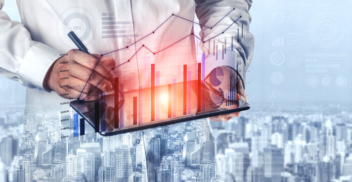 A businessman uses a digital tablet to analyze financial data trends. The image features graphs and statistics overlaying a modern cityscape background, reflecting professionalism. Scalp