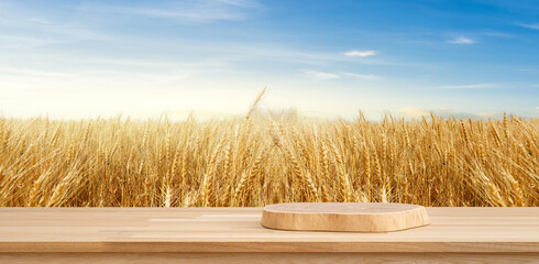 Podium Amidst Golden Fields: A wooden podium stands in the foreground, ready to showcase a product, set against a backdrop of a vast field of golden wheat and a brilliant blue sky.