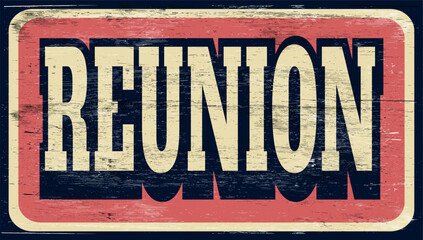 aged and worn reunion sign on wood