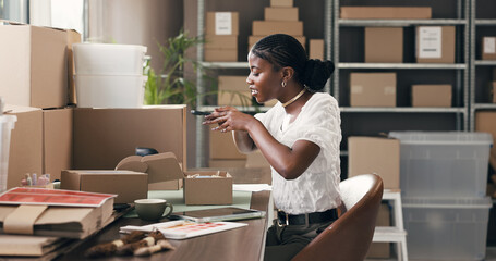 Ecommerce, box and picture with black woman in warehouse for delivery, distribution and courier. Logistics, supplier startup and product promotion with person for supply chain photography and app