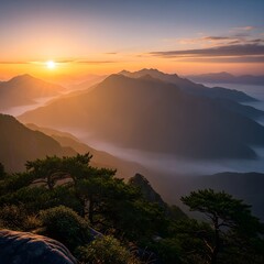 Golden Sunrise Over Misty Mountain Range