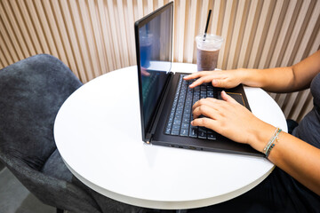 Digital nomad in cafe, remote worker with laptop in cafe.