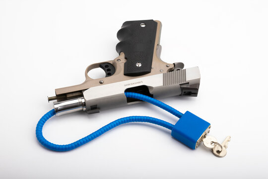 Automatic pistol hand gun  with Locked disarmed and secured on white background , Gun Safety concept