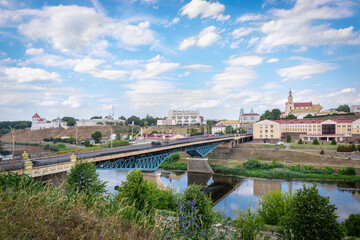 Obraz premium Cityscape of Grodno with Bridge and Historic Architecture