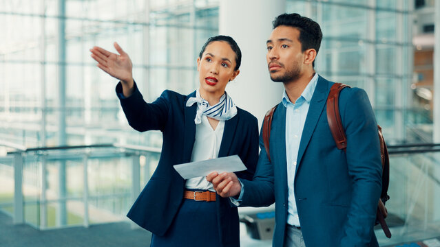 People, gate agent and direction with traveler, boarding pass or ticket for assistance in airport. Man, woman or attendant helping customer with instruction for travel, departure or flight service
