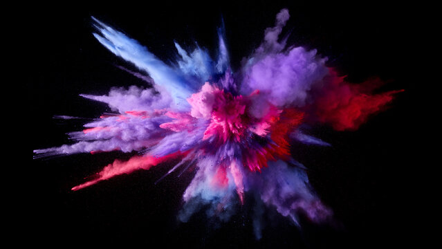 Colorful powder explosion with pink purple and red hues against black