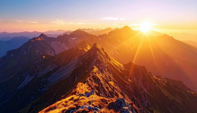 A breathtaking sunrise illuminates a majestic mountain range, with golden rays breaking over the peaks and casting dramatic shadows.